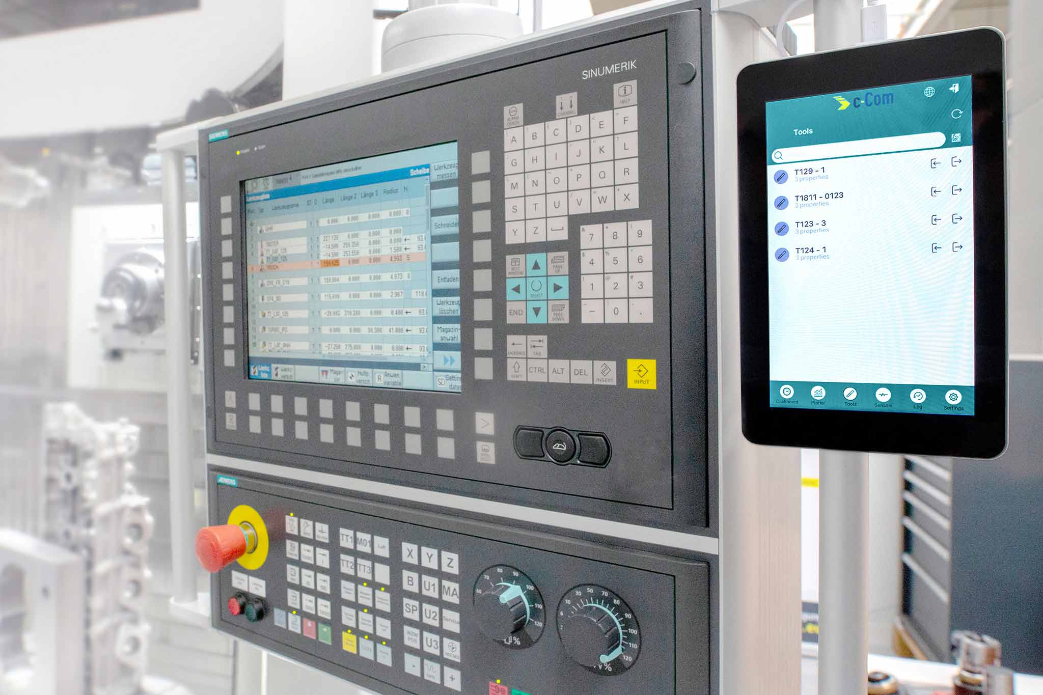In the right-hand third of the image, the c-Connect box, which is connected to the press controls in the centre of the image, is shown. In the right-hand third of the image, the c-Connect box, which is connected to the press controls in the centre of the image, is shown.