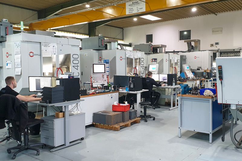 The picture shows a Hermle machining center.