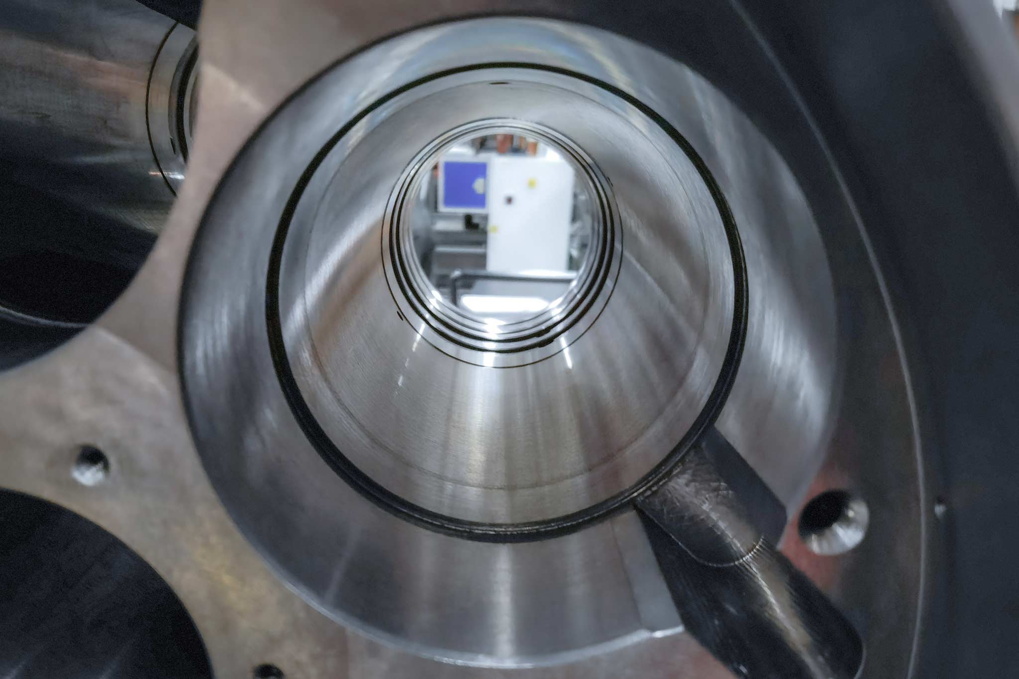 A close-up on a bore to be machined shows the cylindrical areas merging into each other.