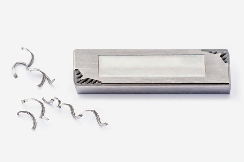 Chips and an insert with chip breakers on the cutting edges.