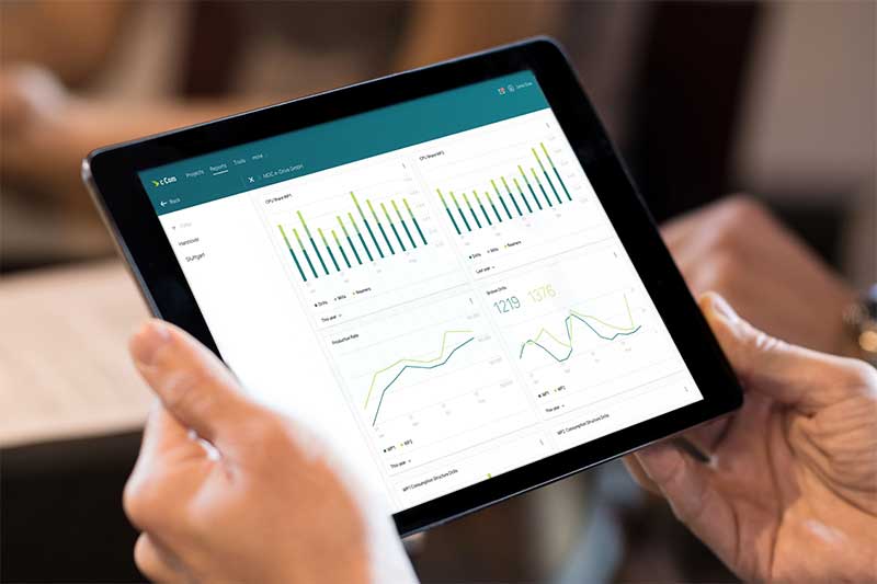 The picture shows a tablet on which the application interface of c-Com GmbH is running.
