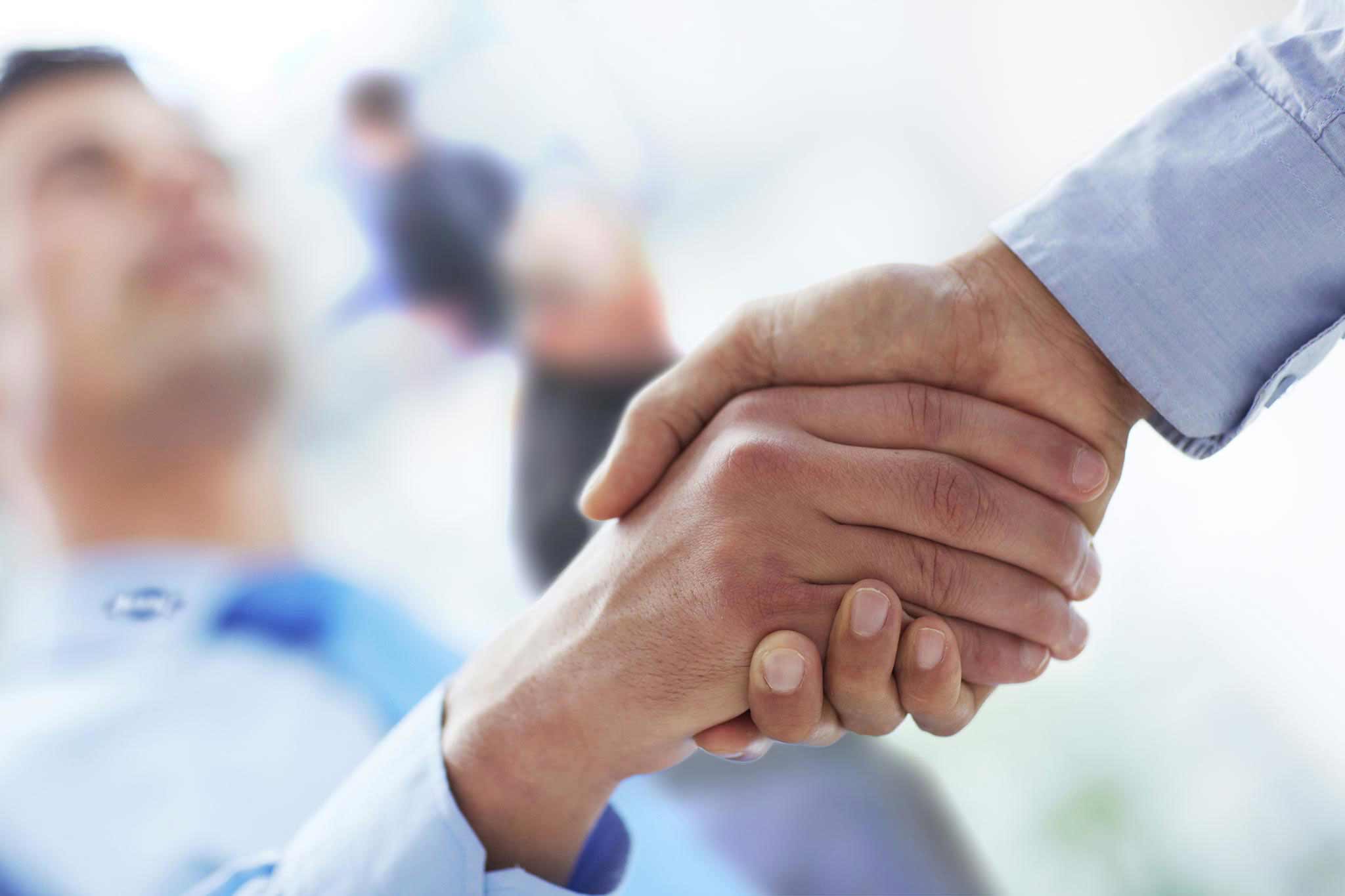 Two people shaking hands.