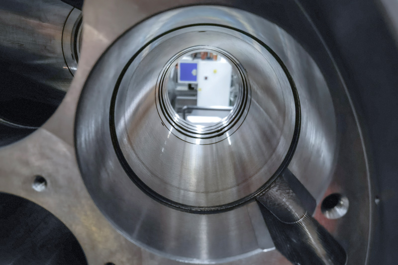 A close-up on a bore to be machined shows the cylindrical areas merging into each other.