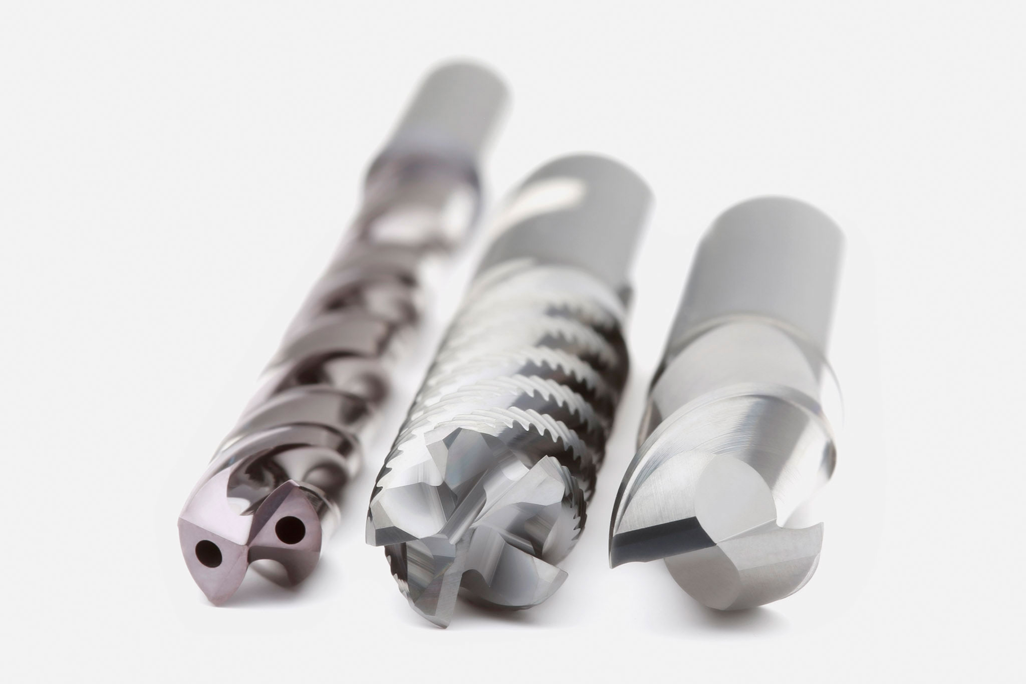 From the left the MEGA-Speed-Drill-Steel, the OptiMill-Uni-Wave and the OptiMill-Uni-HPC-Plus in front view.