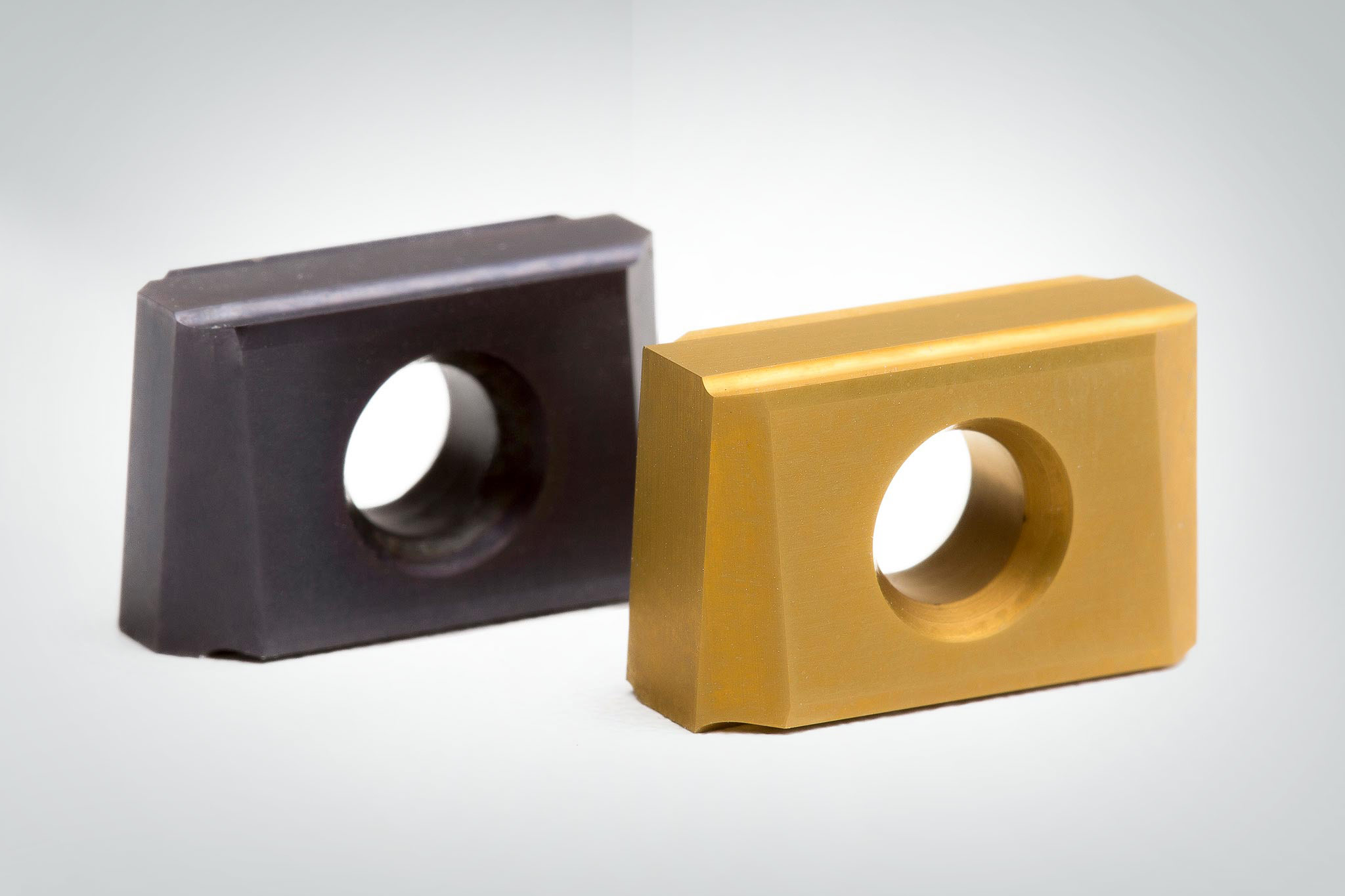Two reversible cutting plates with different coatings are shown.