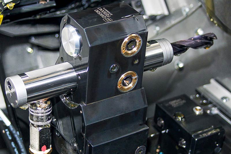 The picture shows the special MAPAL hydraulic chuck on the TORNOS machine.